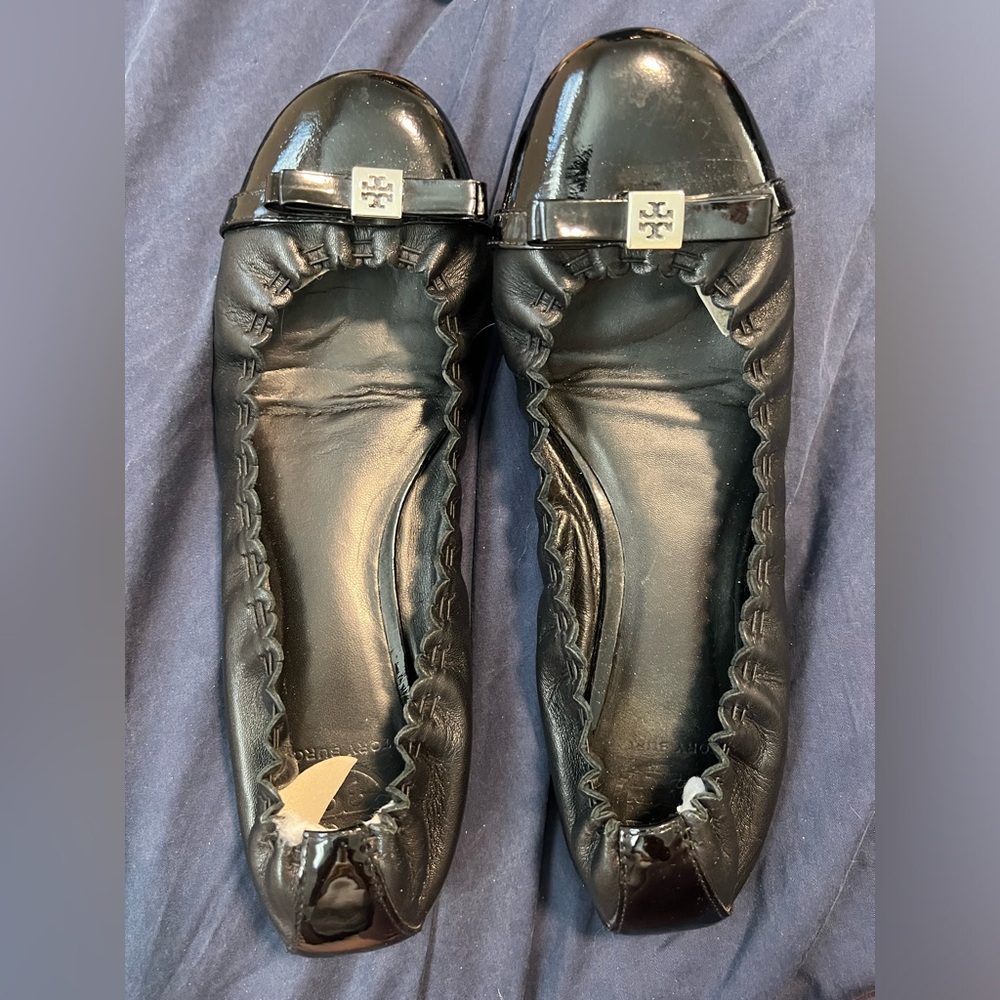 Tory Burch black leather with patent leather toe and cute bow